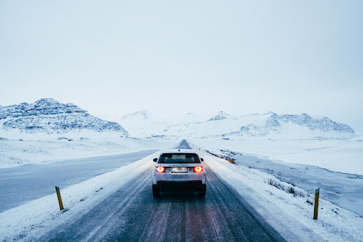 Land Rover Discovery driving on snowy road in Iceland 