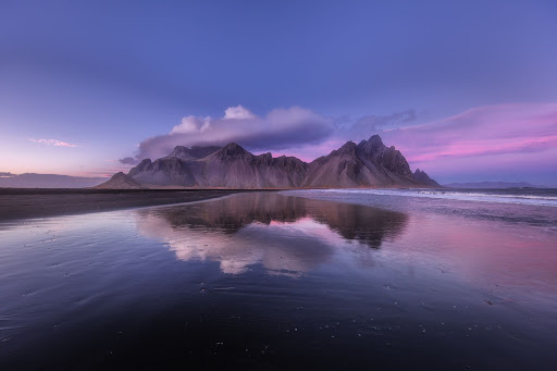 Mountain in Iceland covered by cloud at sunset